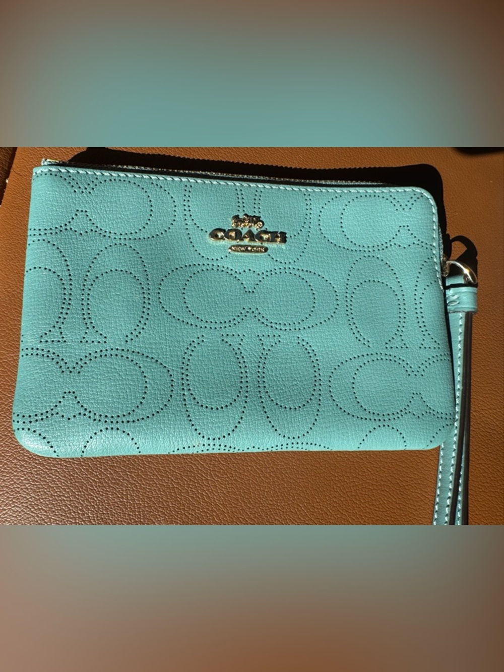 Coach Mint Green Perforated Leather Wristlet with Gold Logo
